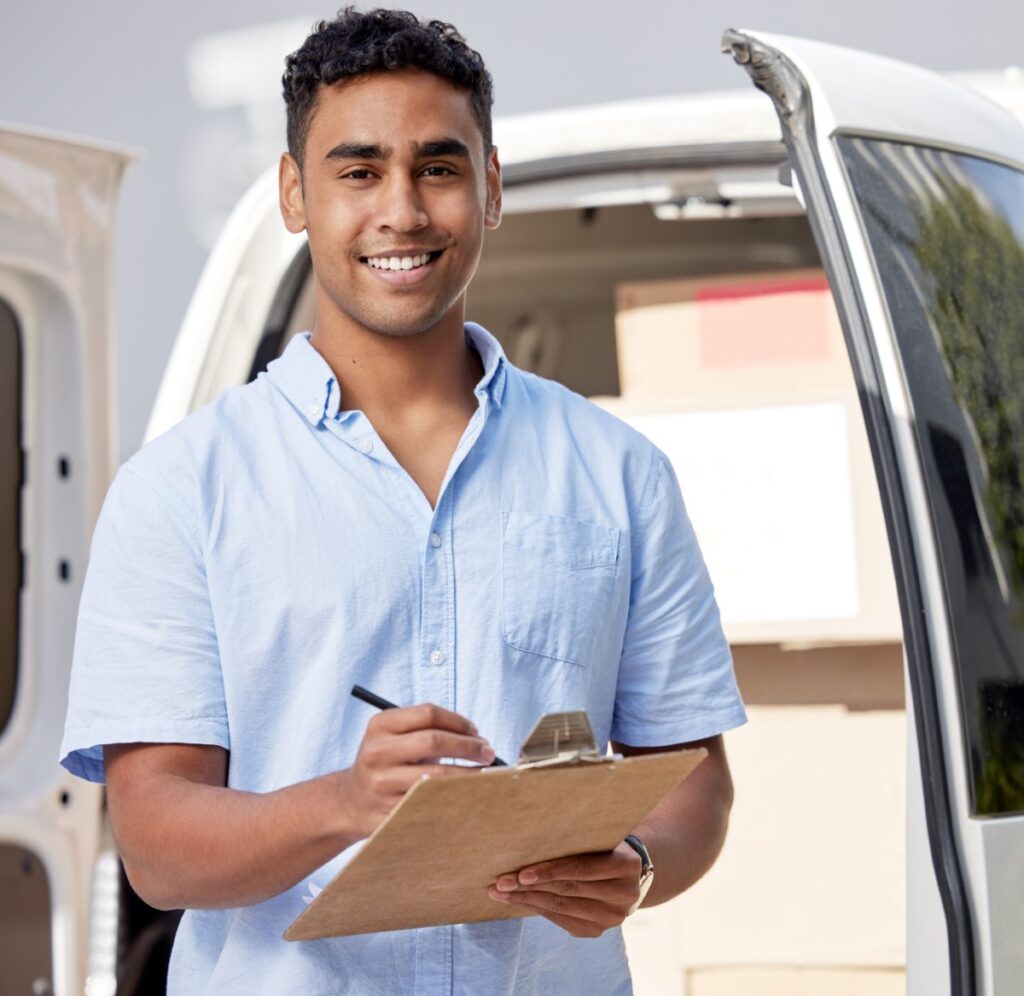 Portrait of a young delivery man writing on a clip 2025 04 06 01 11 28 utc.jpg